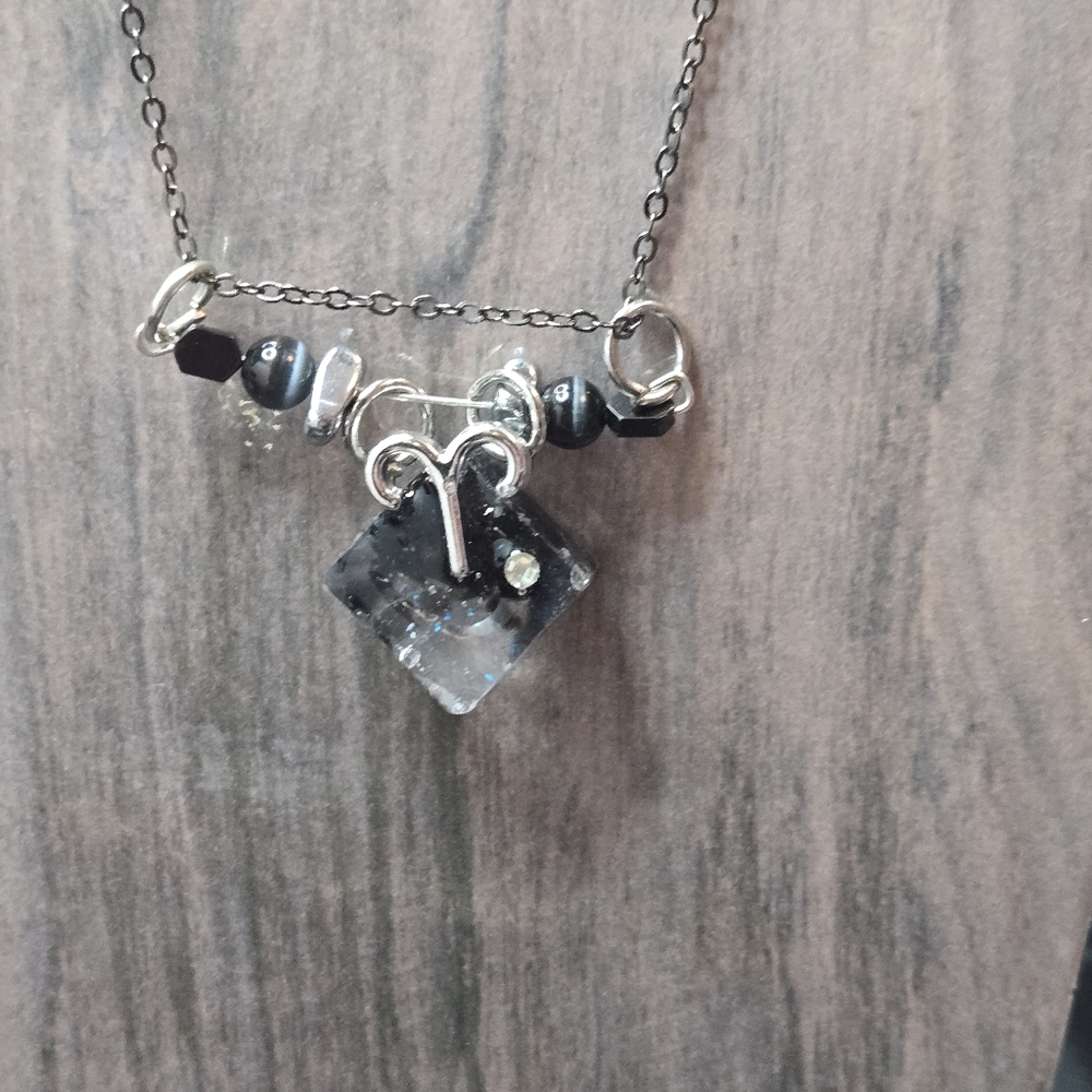 Earth Art Hand Crafted Artisan Black and Silver Aries Necklace